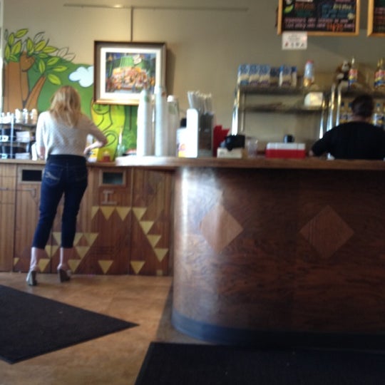 Foto tomada en Firefly Coffee House  por Lenay el 9/18/2012