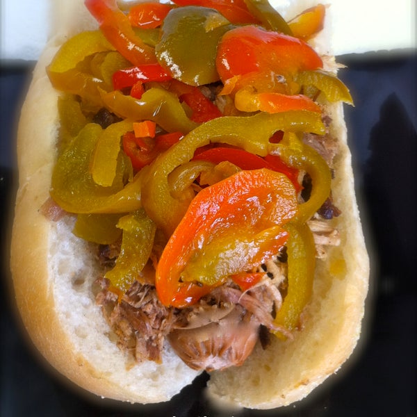 Try our Big Ed! (Any meat (I recommend Brisket) 2 slices of Wisconsin cheddar, a slice of spanish onion, topped with italian sweet peppers!  Curley's Favorite!