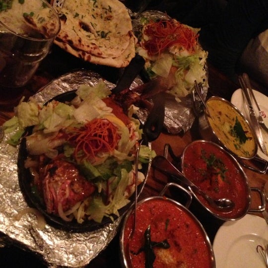 Photo taken at Brick Lane Curry House by Ashley C. on 10/20/2012