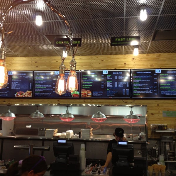Photo taken at BurgerFi by Carlos on 8/11/2013