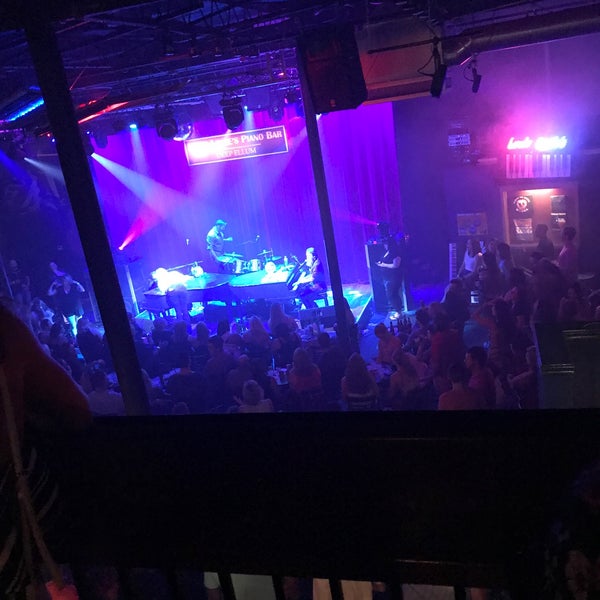 Photo taken at Louie Louie&#39;s Dueling Piano Bar by Brett B. on 8/26/2018