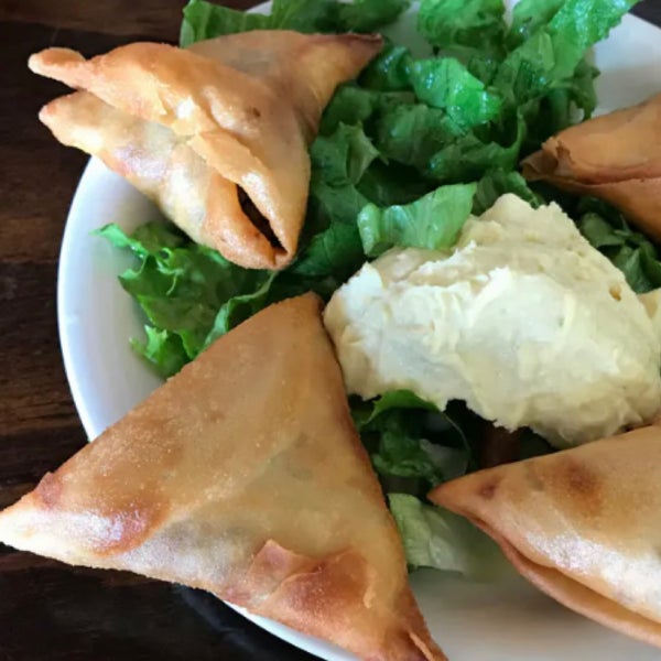 Try sambusas, triangular pastries stuffed with piquant jalapeño-spiked lentils & sautéed collard greens, lentils in smoky berbere and split peas with turmeric and ginger