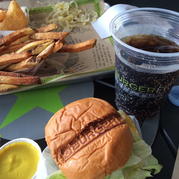 Photo taken at BurgerFi by Andrezza C. on 4/16/2015