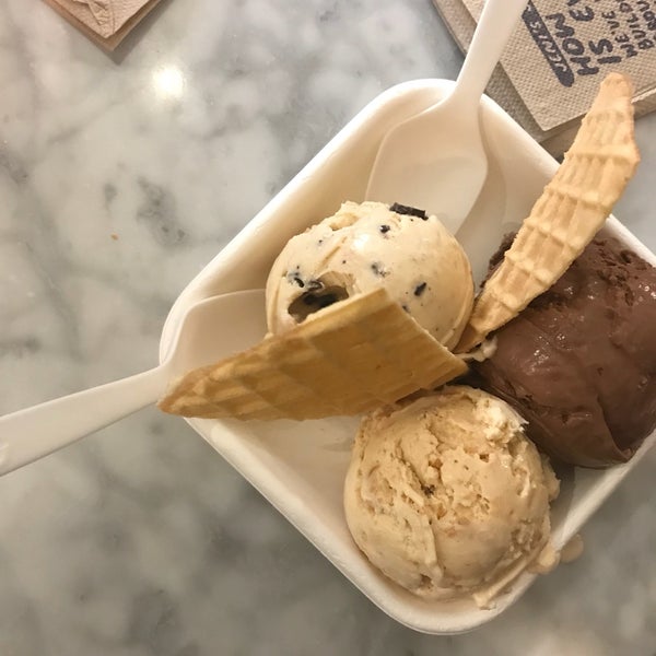 Get the "flight" (the $6.00 option, whatever it's called) and add half-scoops as desired.  It's the same quantity as multiple cups or cones, but cheaper.