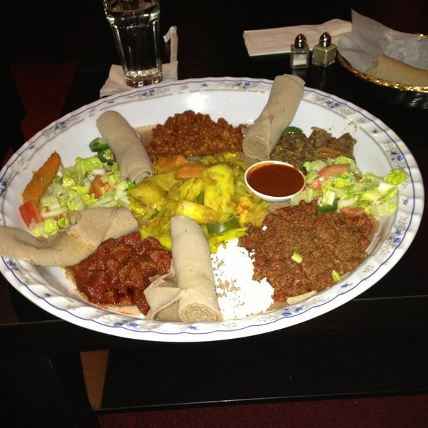 Photo taken at Lucy Ethiopian Restaurant &amp; Lounge by Deeba A. on 3/6/2013
