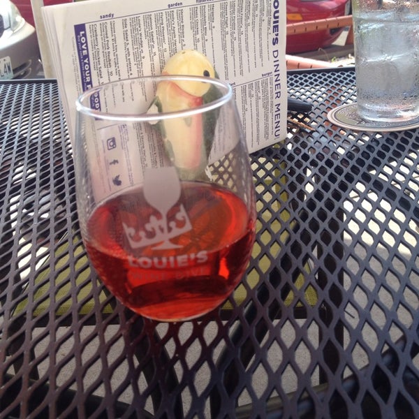 Photo taken at Louie&#39;s Wine Dive by Michelle B. on 7/19/2014