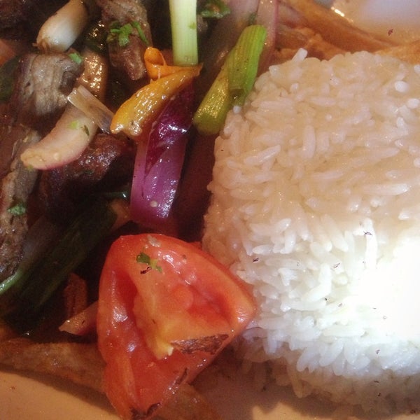 Photo taken at Lola&#39;s Peruvian Restaurant by Christian S. on 7/8/2014