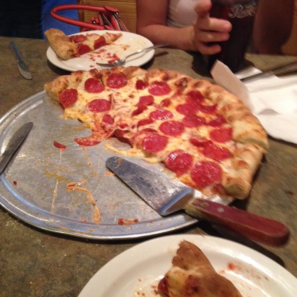 Photo taken at Grand Pizza by Brandon L. on 7/13/2014