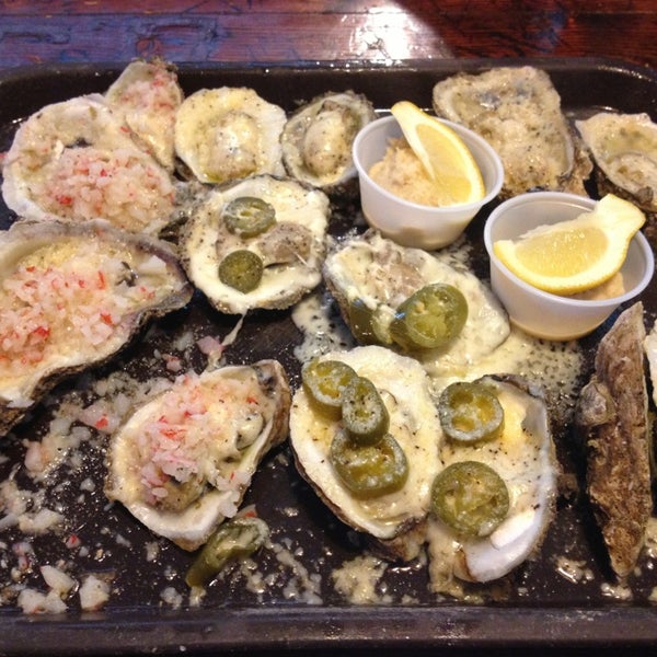 Photo taken at Shuckums Oyster Pub &amp; Grill by Dante F. on 12/19/2012
