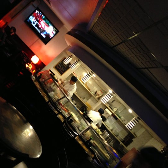 Photo taken at Planet Sushi by Charlie R. on 2/23/2013
