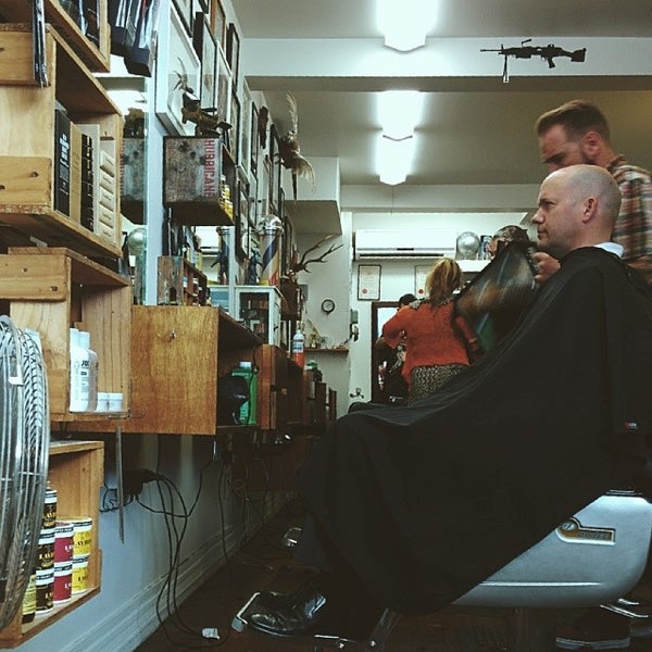 Photo taken at Maloney&#39;s Barber Shop by Richard H. on 1/30/2014