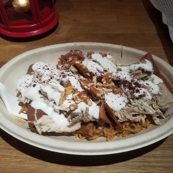 The Bedouin Chicken is amazing! Pulled chicken in a broth, over red basmati rice with pita chips and yogurt sauce. Ive never had anything like it.