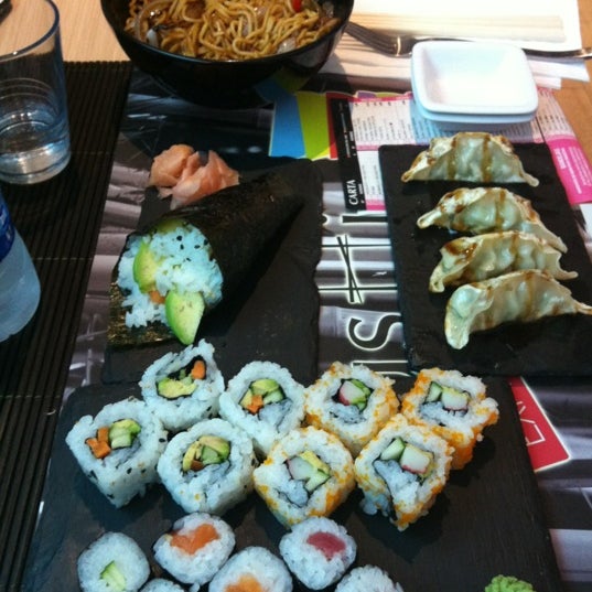 Photo taken at Sushi Store Express by Aurora C. on 10/12/2012