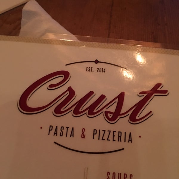 Photo taken at Crust Pasta &amp; Pizzeria by Dave W. on 12/1/2016