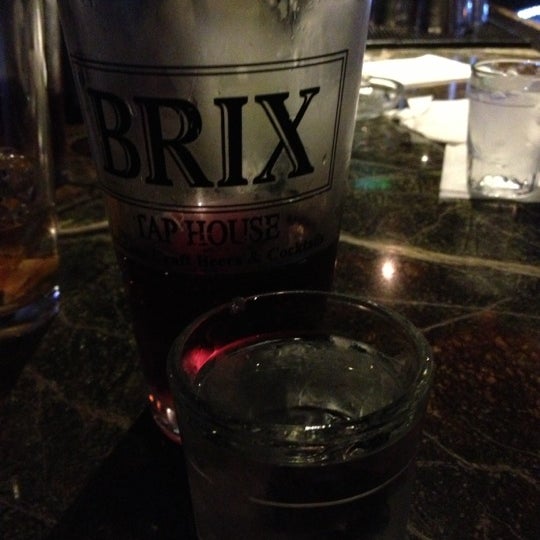 Photo taken at The Brix Taphouse by Mandy B. on 12/31/2012
