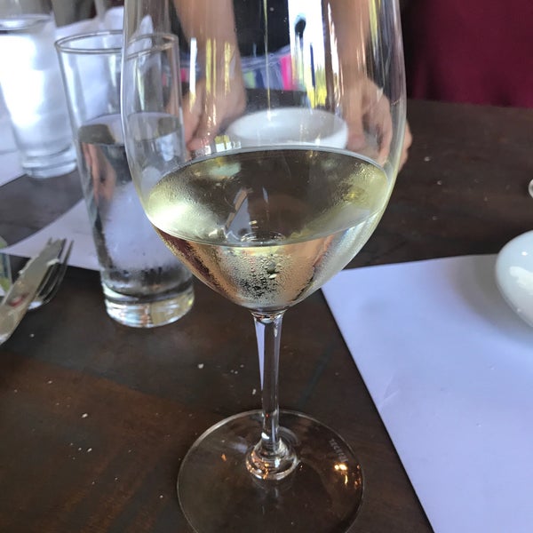 Foto diambil di Purple Café and Wine Bar oleh Victoria N. pada 6/25/2018