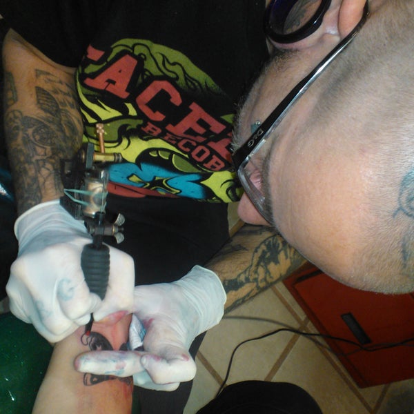Andrew tattooing a cover-up