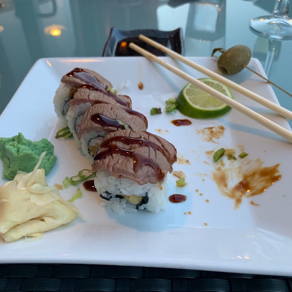 Photo taken at Mura Japanese Restaurant by Johnnie B. on 7/25/2019