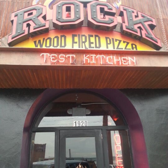 Photo taken at The Rock Wood Fired Pizza by Rebecca S. on 12/30/2012