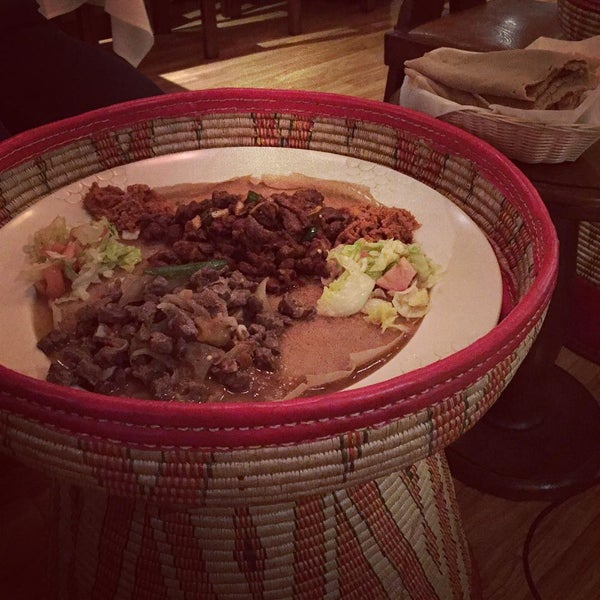 Photo taken at Messob Ethiopian Restaurant by Michelle J. on 1/25/2016