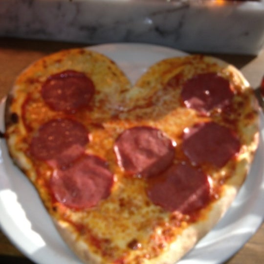 first time for me to order a pizza.. and i was shocked when i got it. A heart-shaped Salame Pizza.