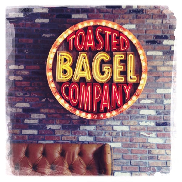 Photo taken at Toasted Bagelry &amp; Deli by Shannon on 7/3/2013