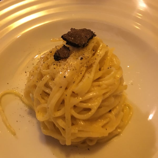 Delicious truffle taglioni cooked in a parmigiana wheel, but small portions, order an antipasto. Great panna cotta, but small too.