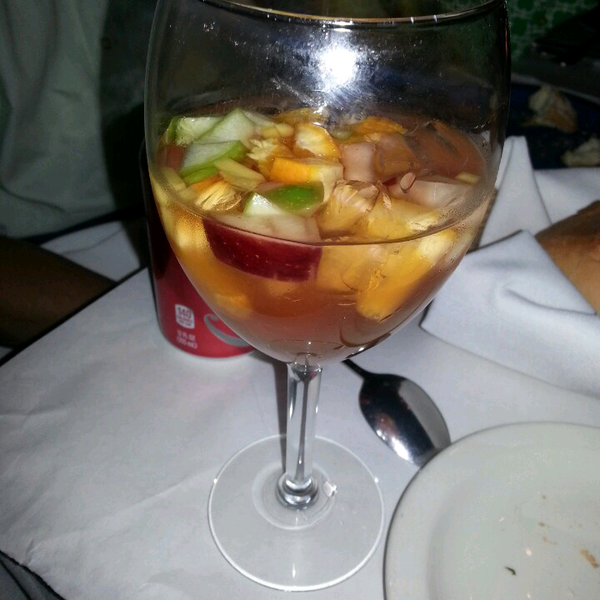 Pink Sangria.  Taste like a drink called Ensalada with a nice kick! Small diced green & red apple & oranges.