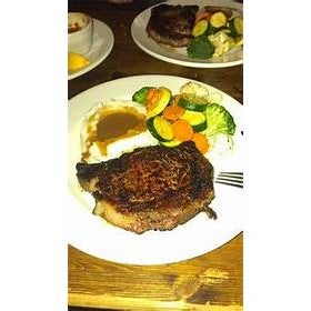 Photo taken at Stubrik&#39;s Steakhouse by Business o. on 9/25/2019