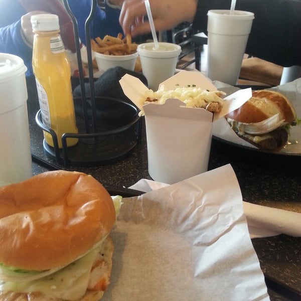Photo taken at Dave &amp; Tony&#39;s Premium Burger Joint by Ashlee H. on 2/26/2014