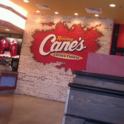 Photo taken at Raising Cane&#39;s Chicken Fingers by Melyssa G. on 12/24/2011