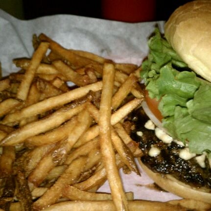 Photo taken at Sinful Burger Sports Grill by Catherine E. on 2/7/2012