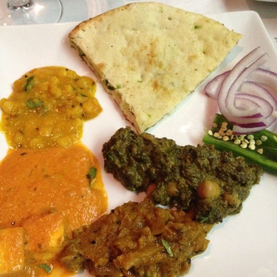 Photo taken at TAVA Contemporary Indian Cuisine by Sunny J. on 4/14/2012