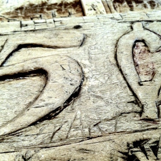 Sit at the bar and read what people have carved in the bar