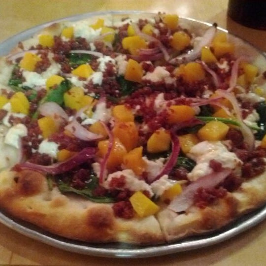 Photo taken at Gusto Pizza Co. by Justin S. on 2/10/2012