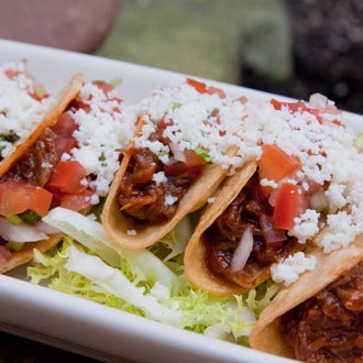 Try the shredded-beef mini taco here, you'll get six deep-fried tortillas cradling shredded beef melded with a sweet-and-smoky BBQ sauce. It's one of NYC's 26 best tacos!