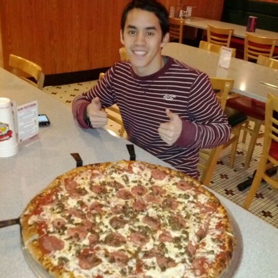 Photo taken at The Original Graziano&#39;s Pizza Restaurant by Angela L. on 12/30/2011