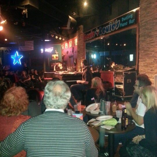 Photo taken at Louie Louie&#39;s Dueling Piano Bar by sarah h. on 2/17/2013