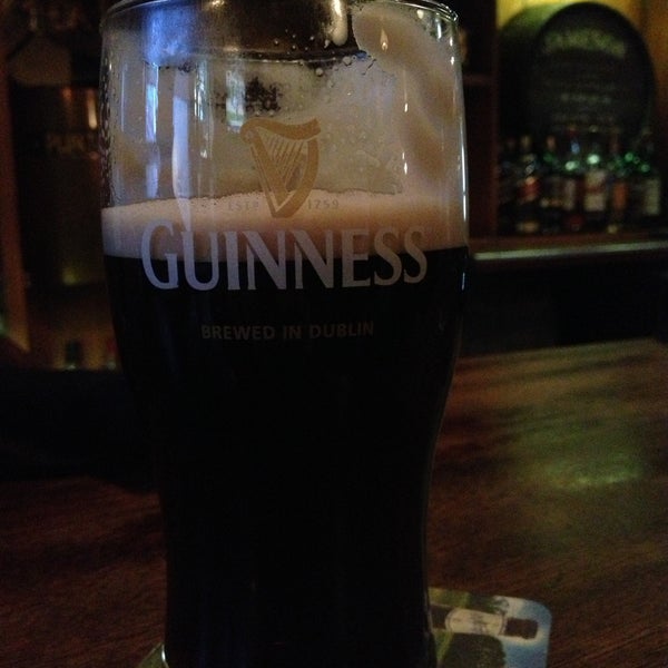 Photo taken at Tigin Irish Pub by Caroline D. on 4/28/2013