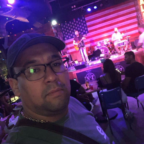 Photo taken at Tin Roof by Flavio N. on 5/1/2019
