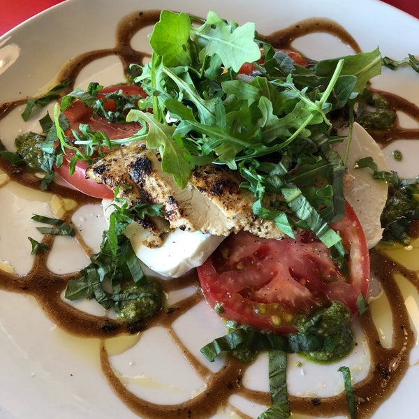 Caprese salad is perfect topped with grilled chicken breast.