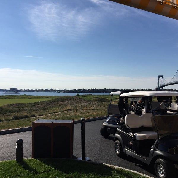 Photo taken at Trump Golf Links at Ferry Point by Dev A. on 8/22/2015