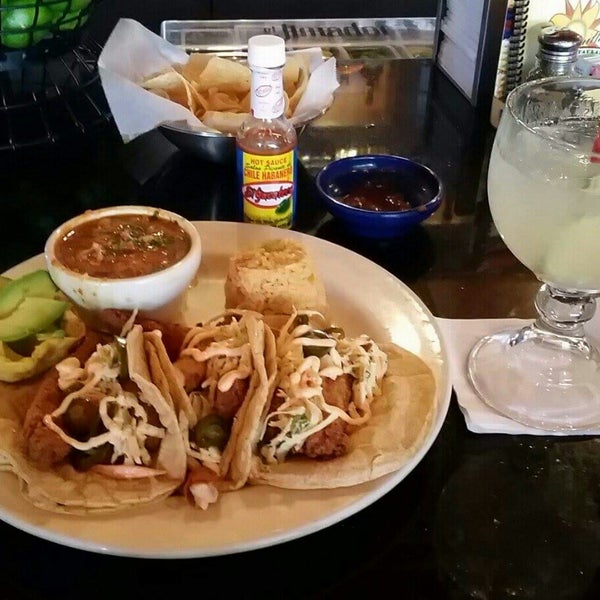 Foto diambil di La Parrilla Mexican Restaurant oleh April M. pada 9/16/2015