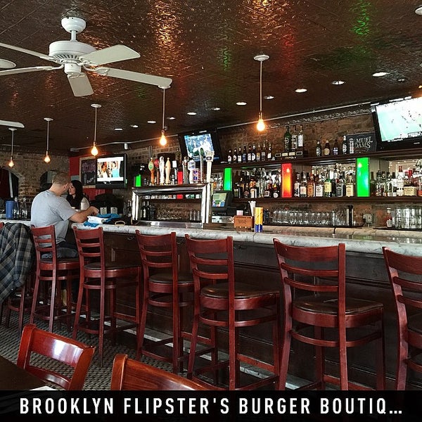 Photo taken at Brooklyn Flipster&#39;s Burger Boutique by Alex C. on 1/9/2015