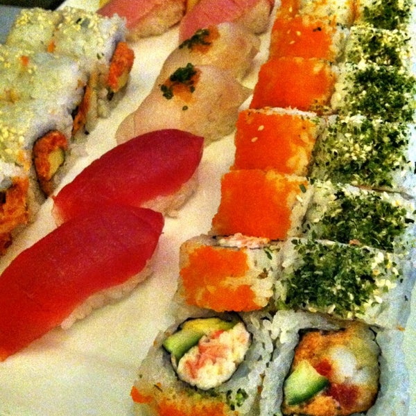 Photo taken at Sushi Sasa by Jenny F. on 3/30/2013