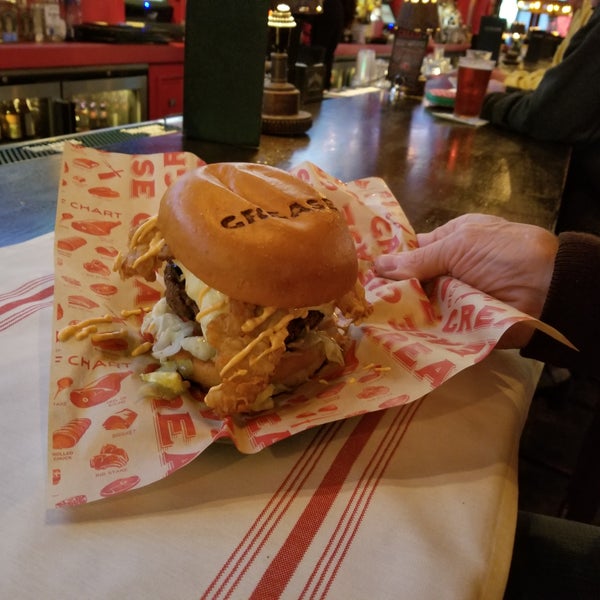 Photo taken at Grease Burger, Beer and Whiskey Bar by Kelly on 1/2/2018