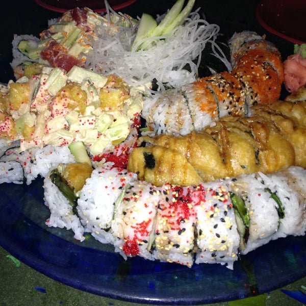 Photo taken at Sushi Blues Cafe by Megan S. on 3/10/2013
