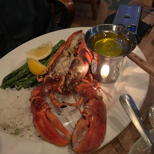 Photo taken at The Sandbar Seafood Restaurant by Roman A. on 5/12/2022