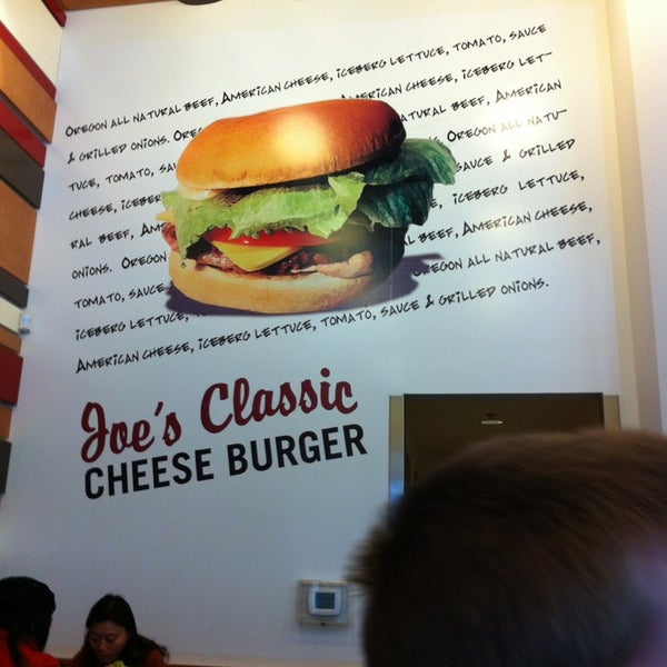 Photo taken at Joe&#39;s Burgers by Kara B. on 12/21/2012