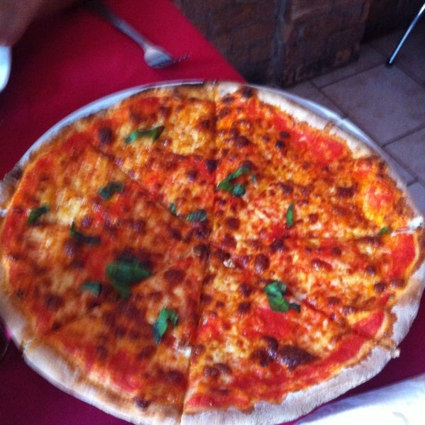 Photo taken at Govinda Italian Restaurant &amp; Pizzeria by Katya A. on 11/11/2013